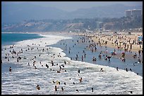 Many people bathing in surf at Santa Monica Beach. Santa Monica, Los Angeles, California, USA ( color)
