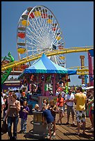 Families, amusement park and ferris wheel. Santa Monica, Los Angeles, California, USA (color)