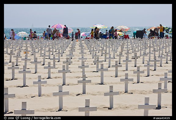 Crosses and beachgoers. Santa Monica, Los Angeles, California, USA (color)