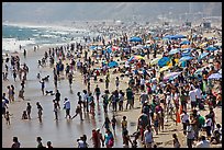 Dense crowds on beach. Santa Monica, Los Angeles, California, USA