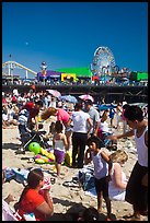 Families on beach and Pacific Park on Santa Monica Pier. Santa Monica, Los Angeles, California, USA (color)