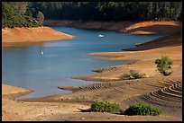 Red earth around an arm of Shasta Lake. California, USA ( color)