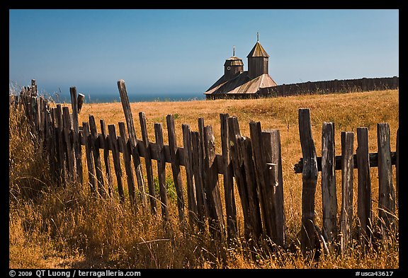 Fences, summer grass and chapel towers, Fort Ross. Sonoma Coast, California, USA