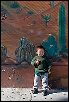 Boy and mural, Mission District. San Francisco, California, USA ( color)