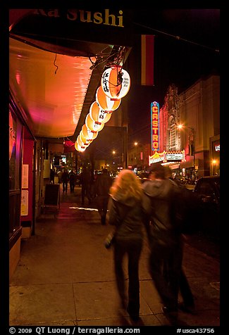 Couple on Castro street at night. San Francisco, California, USA