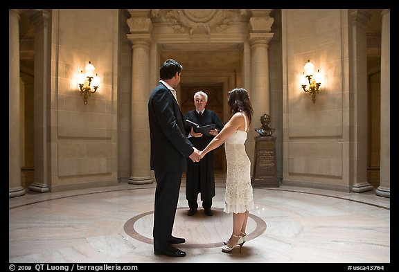 Couple taking marriage wows, City Hall. San Francisco, California, USA