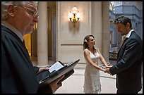 Officiant and couple getting married, City Hall. San Francisco, California, USA ( color)