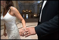 Newly wed couple holds hands, showing ring, City Hall. San Francisco, California, USA ( color)