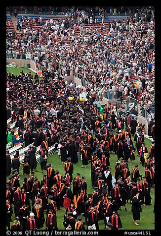 Graduates gather in front of family and friends after commencement. Stanford University, California, USA (color)