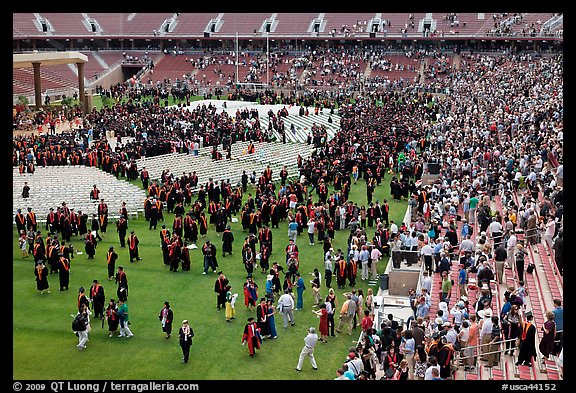 Audience and graduates mingling in stadium after commencement. Stanford University, California, USA (color)