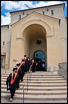 Graduating students in academic robes walk into Memorial auditorium. Stanford University, California, USA (color)