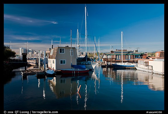 Alameda Houseboats and Oakland skyline. Oakland, California, USA