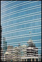 Federal building reflected in glass facade. Oakland, California, USA