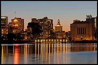 Downtown skyline accross Lake Merritt at dusk. Oakland, California, USA