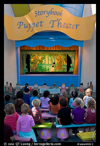 Children look at Snow white puppet show, Fairyland. Oakland, California, USA