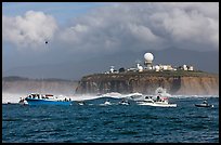 Flottila of boats near Mavericks break in front of Pillar Point radar station. Half Moon Bay, California, USA ( color)