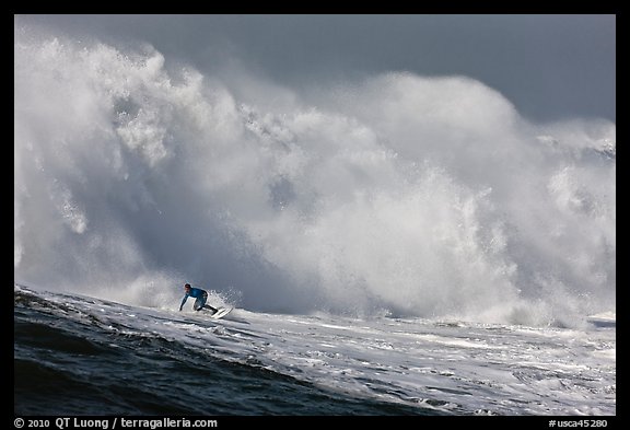 Surfer in Mavericks break. Half Moon Bay, California, USA (color)