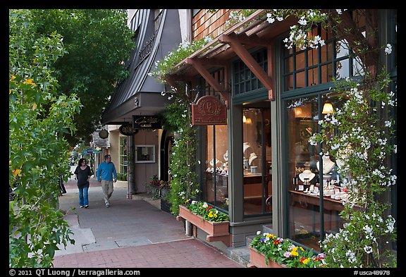 Sidewalk and stores on Ocean Avenue. Carmel-by-the-Sea, California, USA
