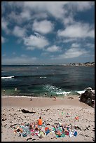 People sunning themselves on beach. Pacific Grove, California, USA ( color)