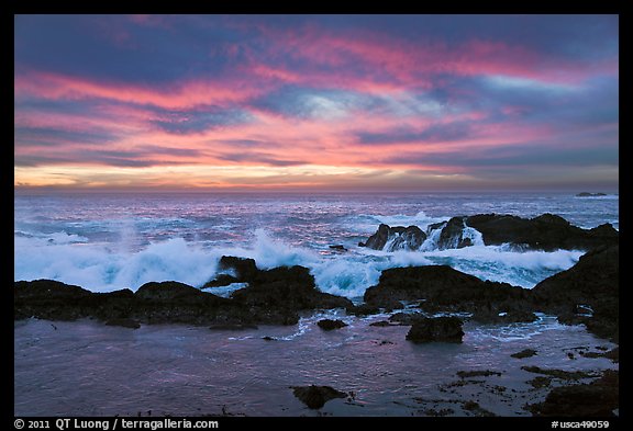 Wave crashing on rock at sunset. Point Lobos State Preserve, California, USA