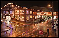 Monterey Canning company building and streets at night. Monterey, California, USA