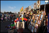 Brooms and religious pictures for sale, San Jose Flee Market. San Jose, California, USA ( color)