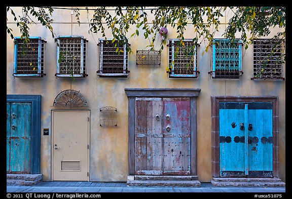 Wall with weathered doors and windows. Santana Row, San Jose, California, USA