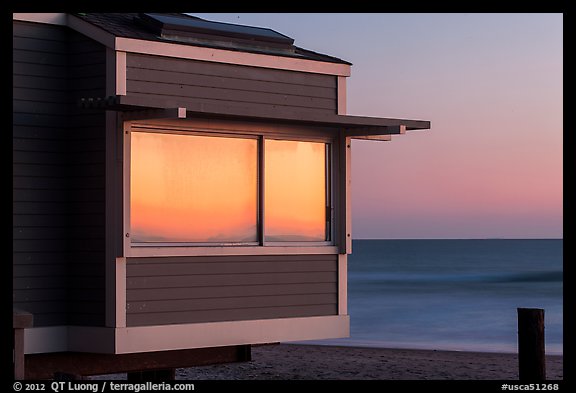 Sunset reflected in beach house window, Stinson Beach. California, USA (color)