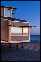Contemporary beach house at dusk, sunset reflection, Stinson Beach. California, USA (color)