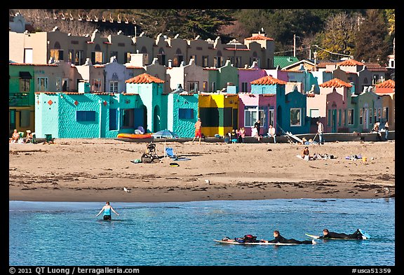 Surfers, beach, and Venetian hotel cottages. Capitola, California, USA (color)