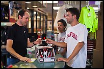 Students paying at register with credit card, Campus Bike Shop. Stanford University, California, USA ( color)