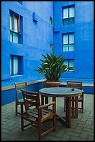 Tables and chairs in blue courtyard, Schwab Residential Center. Stanford University, California, USA (color)