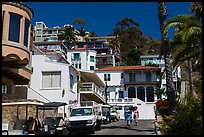 Street with hillside houses looming above, Avalon, Catalina. California, USA ( color)