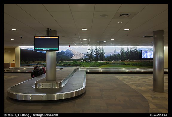Baggage claim area and Tuolumne Meadows mural, Fresno Yosemite Airport. California, USA (color)