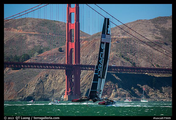 Oracle Team USA defender America's cup boat and Golden Gate Bridge. San Francisco, California, USA