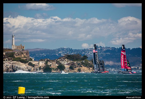 America's cup boats sail away at 40 knots from Alcatraz Island. San Francisco, California, USA (color)