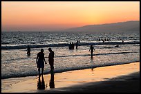 Sunset with beachgoers in water. Santa Monica, Los Angeles, California, USA ( color)