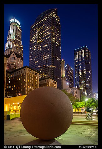 Spherical sculpture and skyscrappers at night, Pershing Square. Los Angeles, California, USA (color)