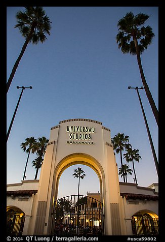 Entrance gate at dusk, Universal Studios. Universal City, Los Angeles, California, USA (color)