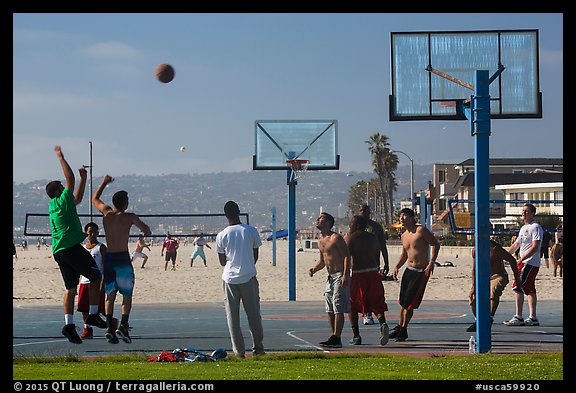 Men playing basketball, Mission Beach. San Diego, California, USA (color)