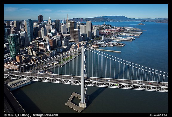 Aerial view of Bay Bridge, downtown, and piers. San Francisco, California, USA (color)