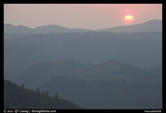 Setting sun and mountain ridges, Stanislaus National Forest. California, USA (color)