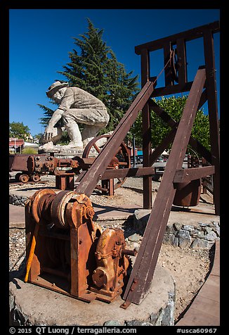 Mining equipment and statue commemorating gold rush, Auburn. Califoxrnia, USA (color)