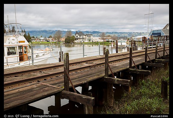 Railroad tresle and Petaluma River and Yacht Club. Petaluma, California, USA