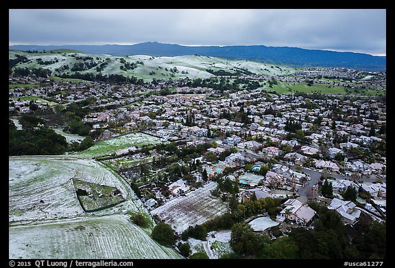 Aerial view of Meadowlands and hills covered by hail. San Jose, California, USA (color)