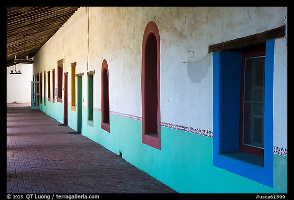 Brightly colored windows, inside arcade, Mission San Miguel. California, USA (color)