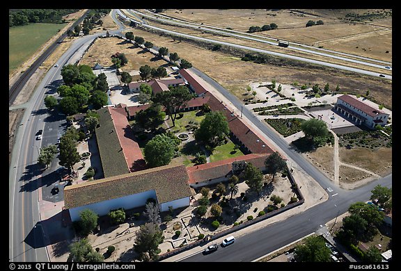 Aerial view of Mission San Miguel between railroad and highway. California, USA (color)
