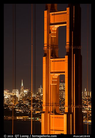 Golden Gate Bridge pillar and city skyline at night. San Francisco, California, USA (color)