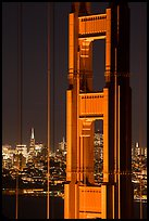 Golden Gate Bridge pillar and city skyline at night. San Francisco, California, USA ( color)