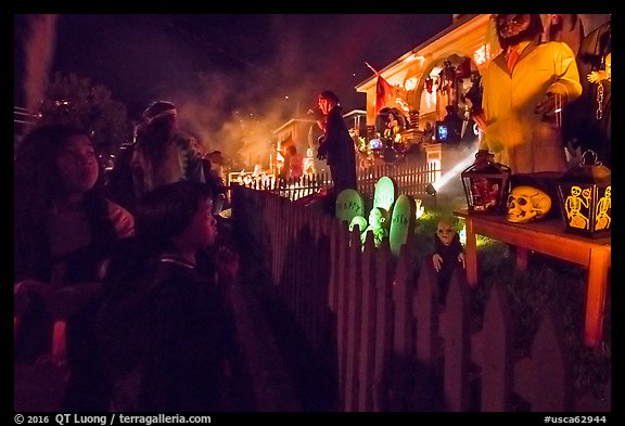 Children look at house with Halloween decorations. Petaluma, California, USA (color)